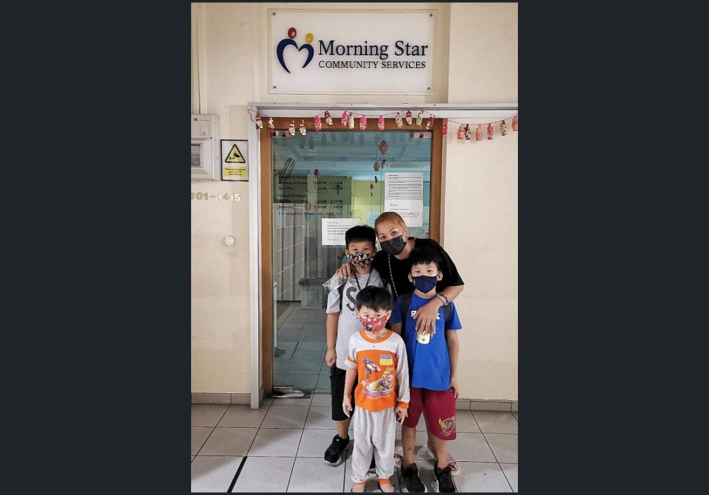 Ms Ivy Koh with her three sons outside Morning Star Community Services @ Primavera Centre, which offers an evening support programme for children. PHOTO: MORNING STAR COMMUNITY SERVICES